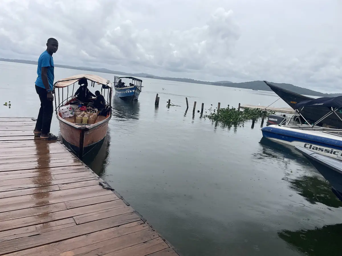 Boats and canoes at a jetty on Lake Victoria